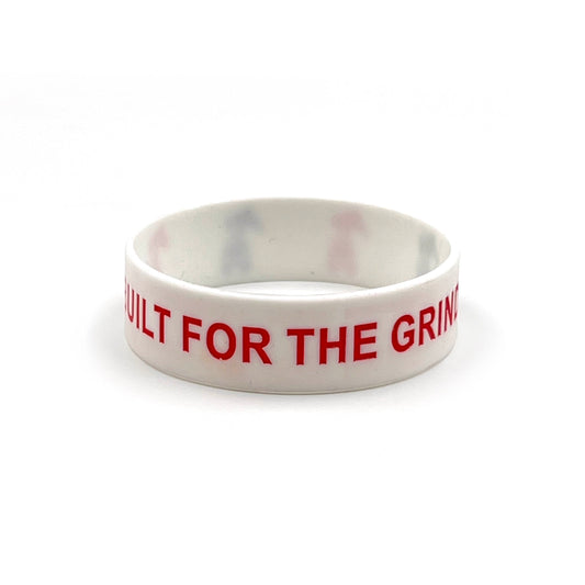White wristband with red and black logo.  Also has Built For The Grind spelled out.